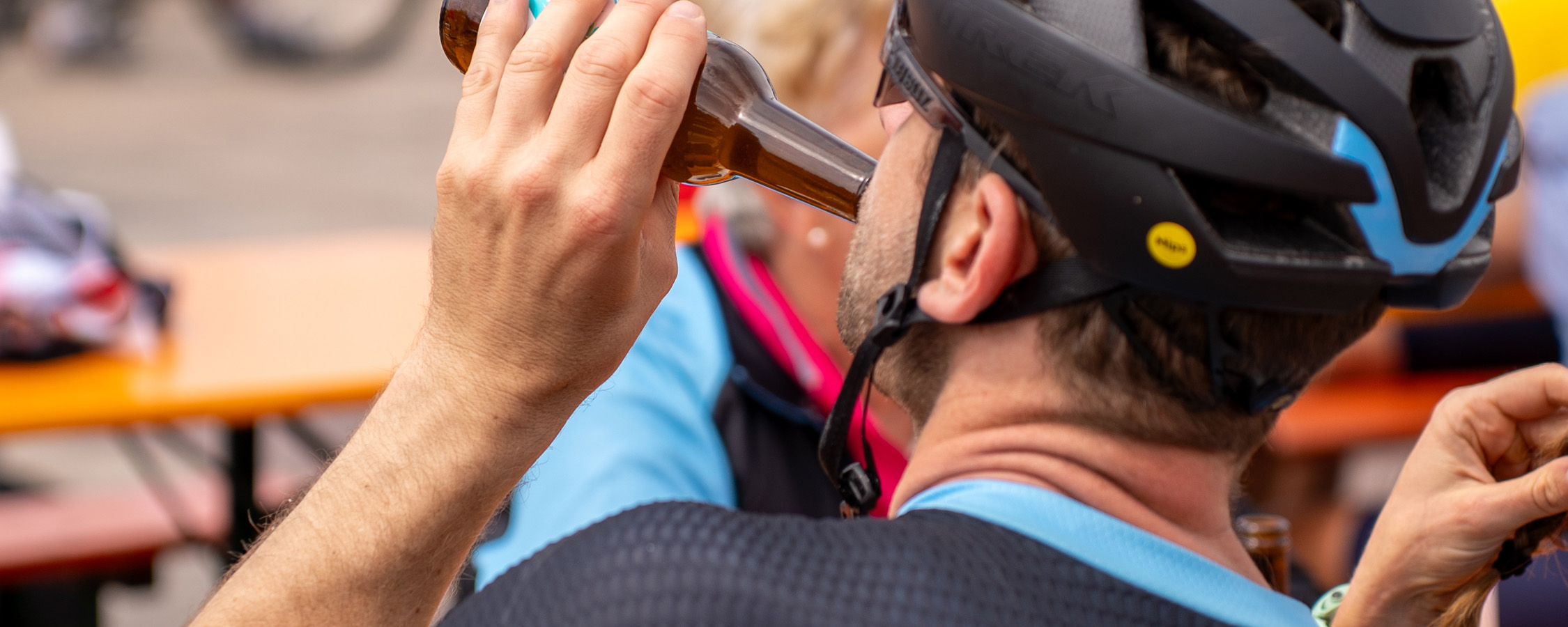 Female cyclist riding through tunnel