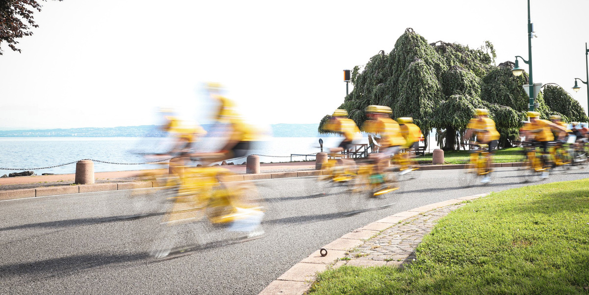 Female cyclist riding through tunnel